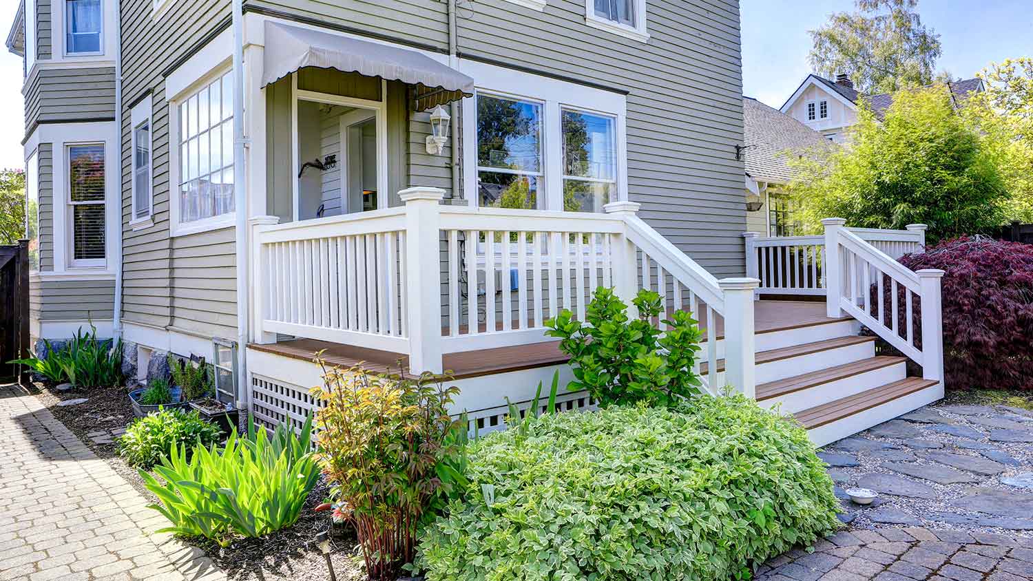 House exterior with deck skirting and railing