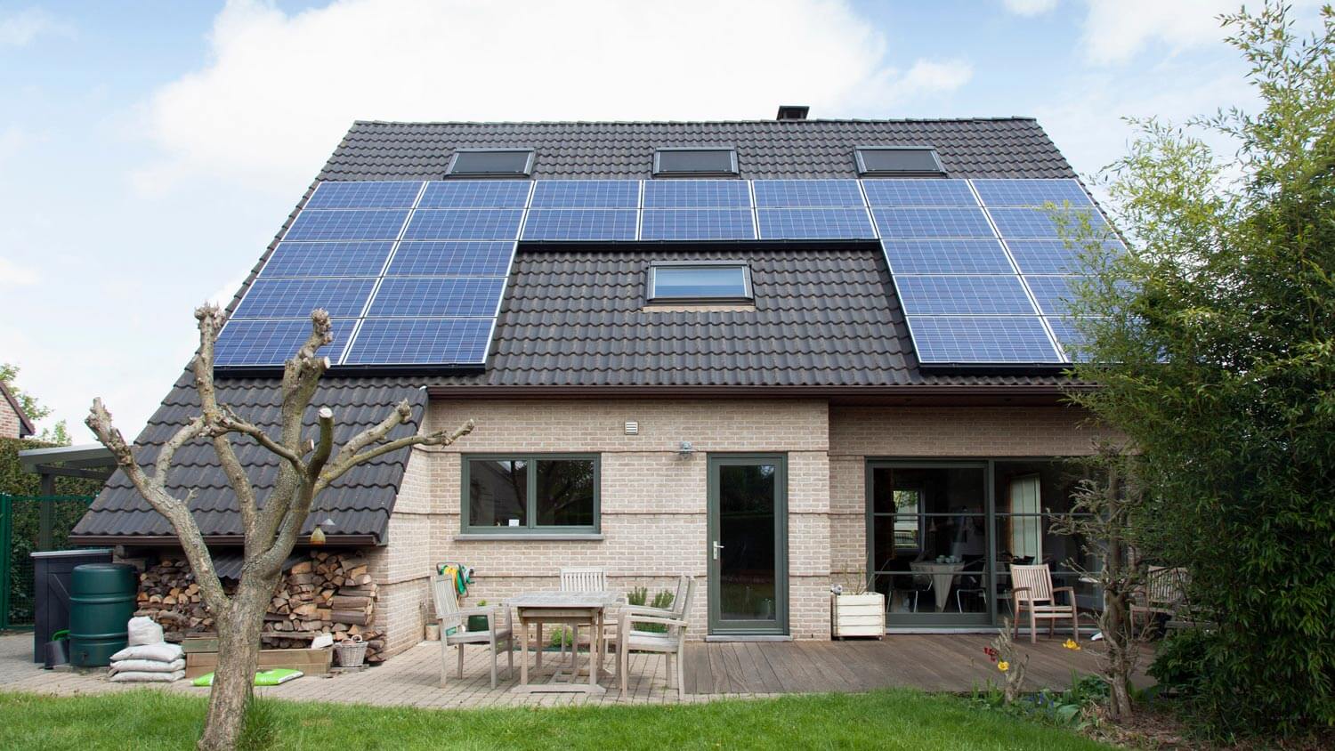 A detached bungalow with solar panels on the roof