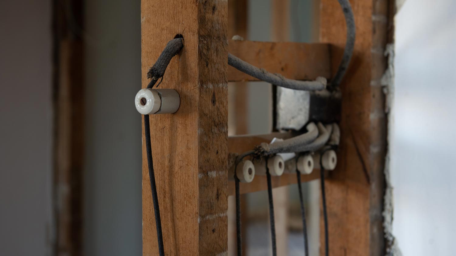 Close-up of a knob and tube wiring