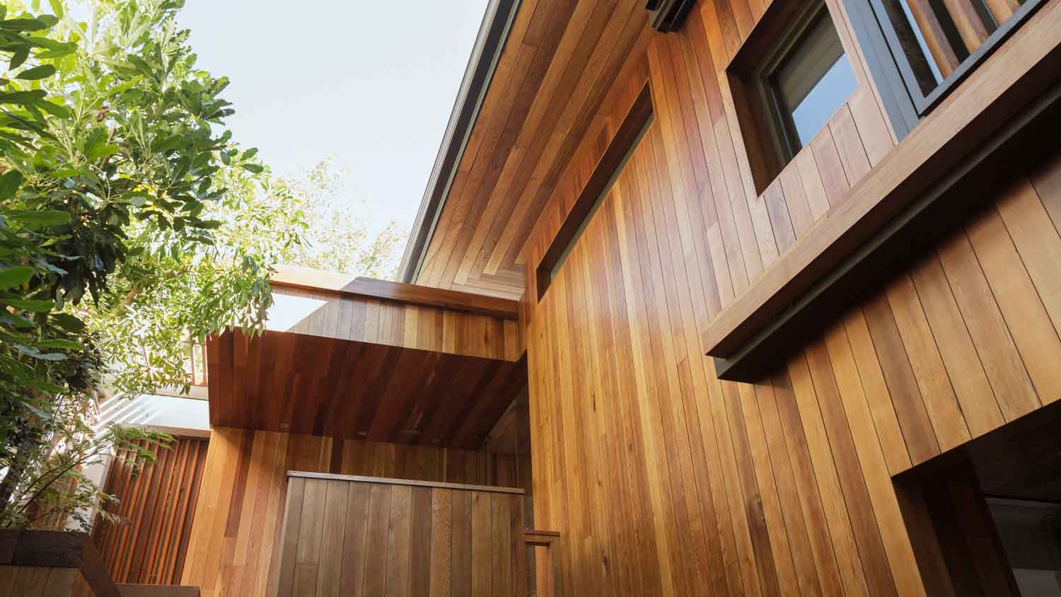 Detail of a natural wood siding house