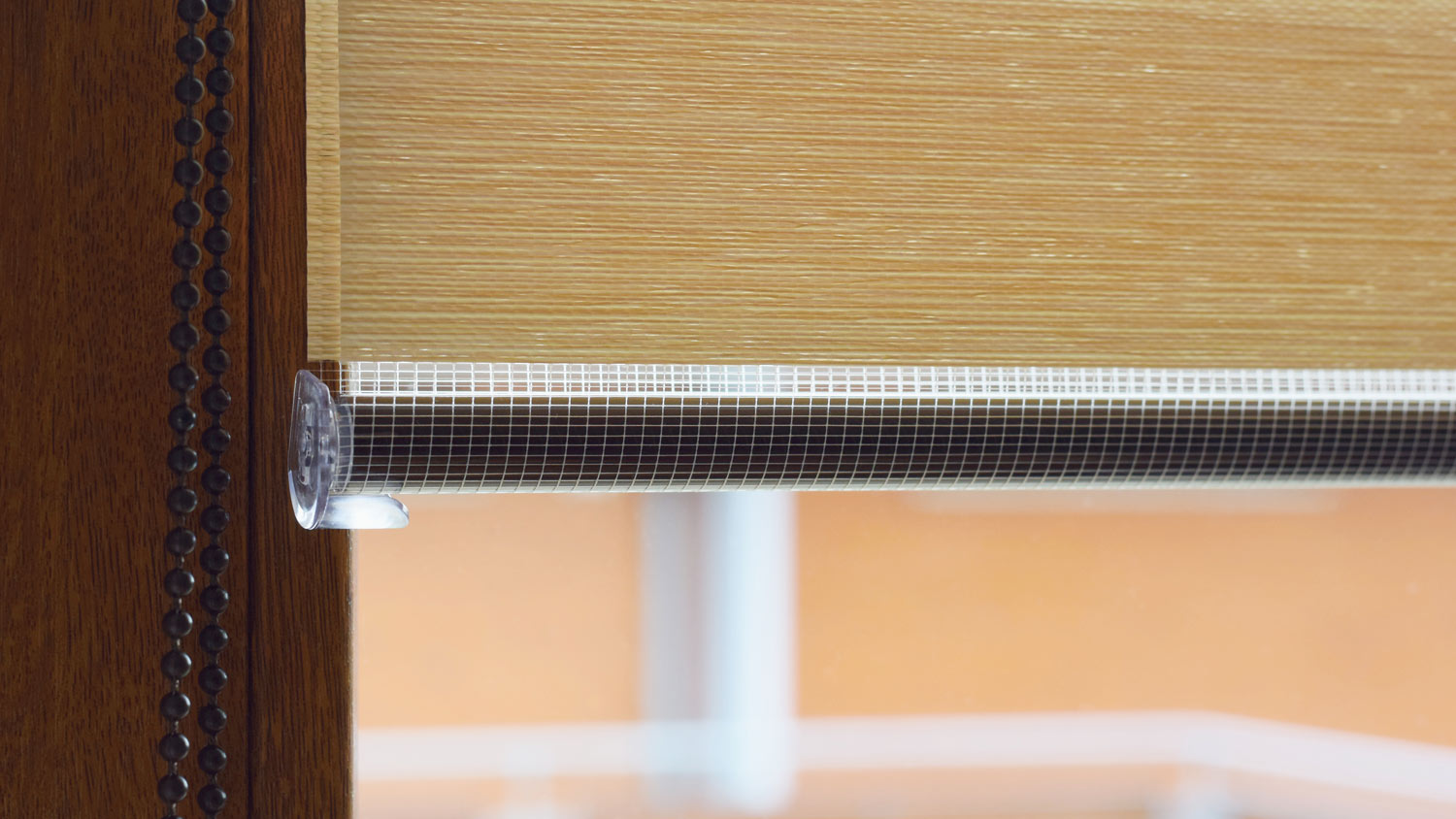 Detail of roller shades on a window