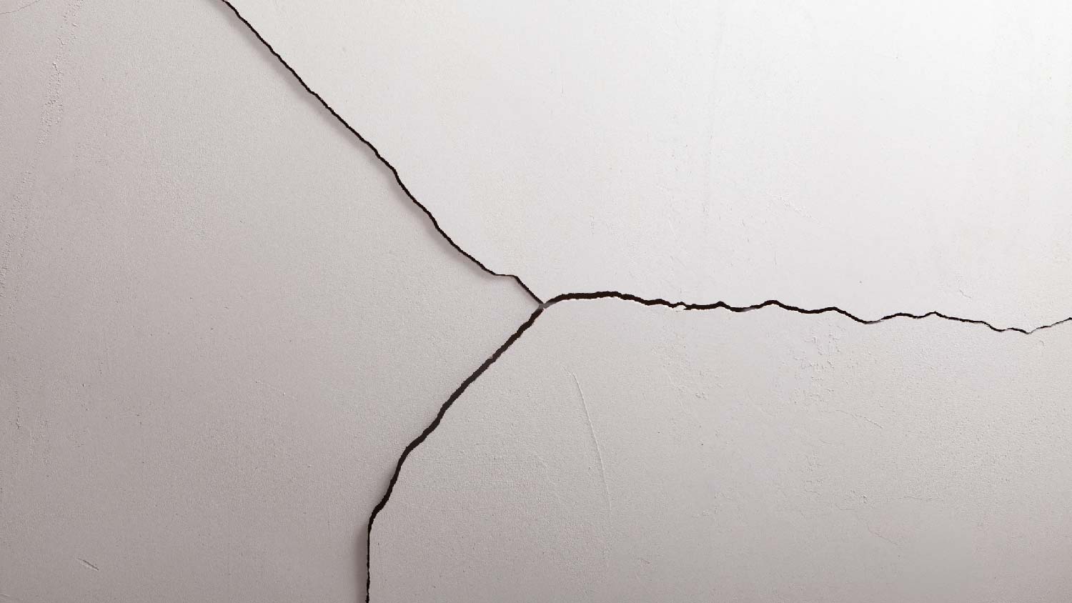 A diagonal crack on drywall