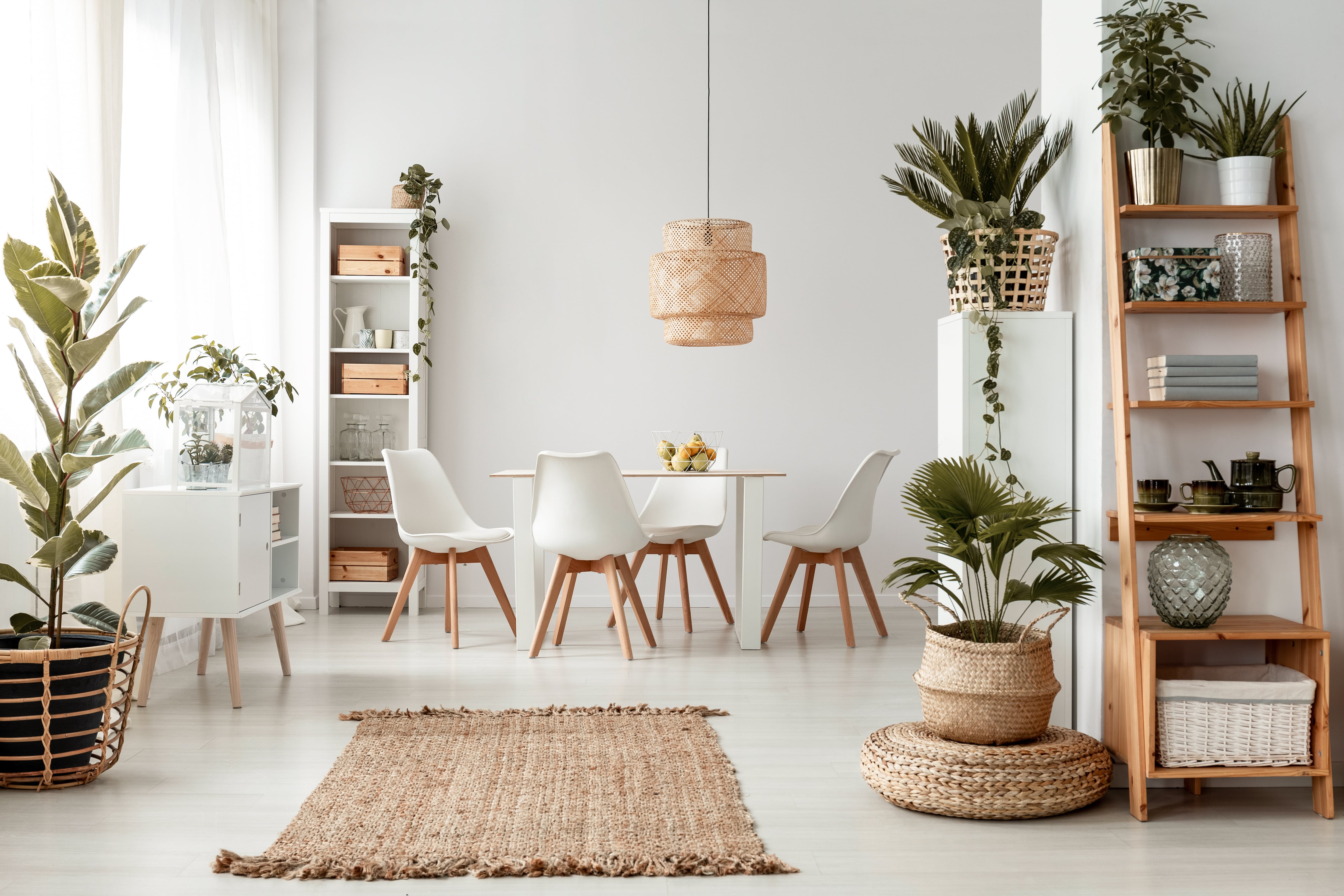 Woven rattan pendant light in white modern dining room 