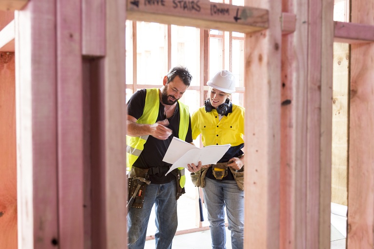 Contractors discussing remodeling plans