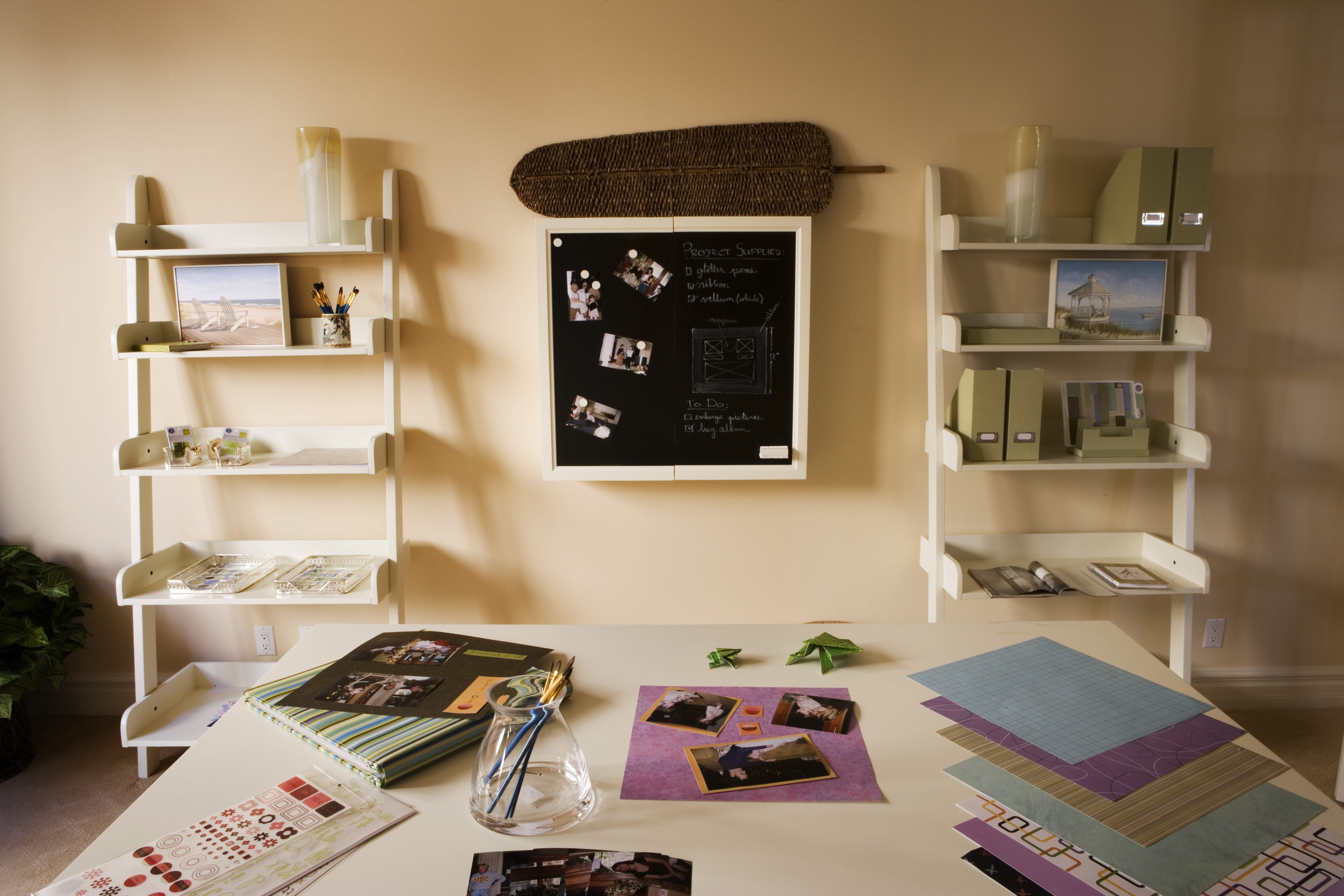 White work desk and white bookshelves in home office