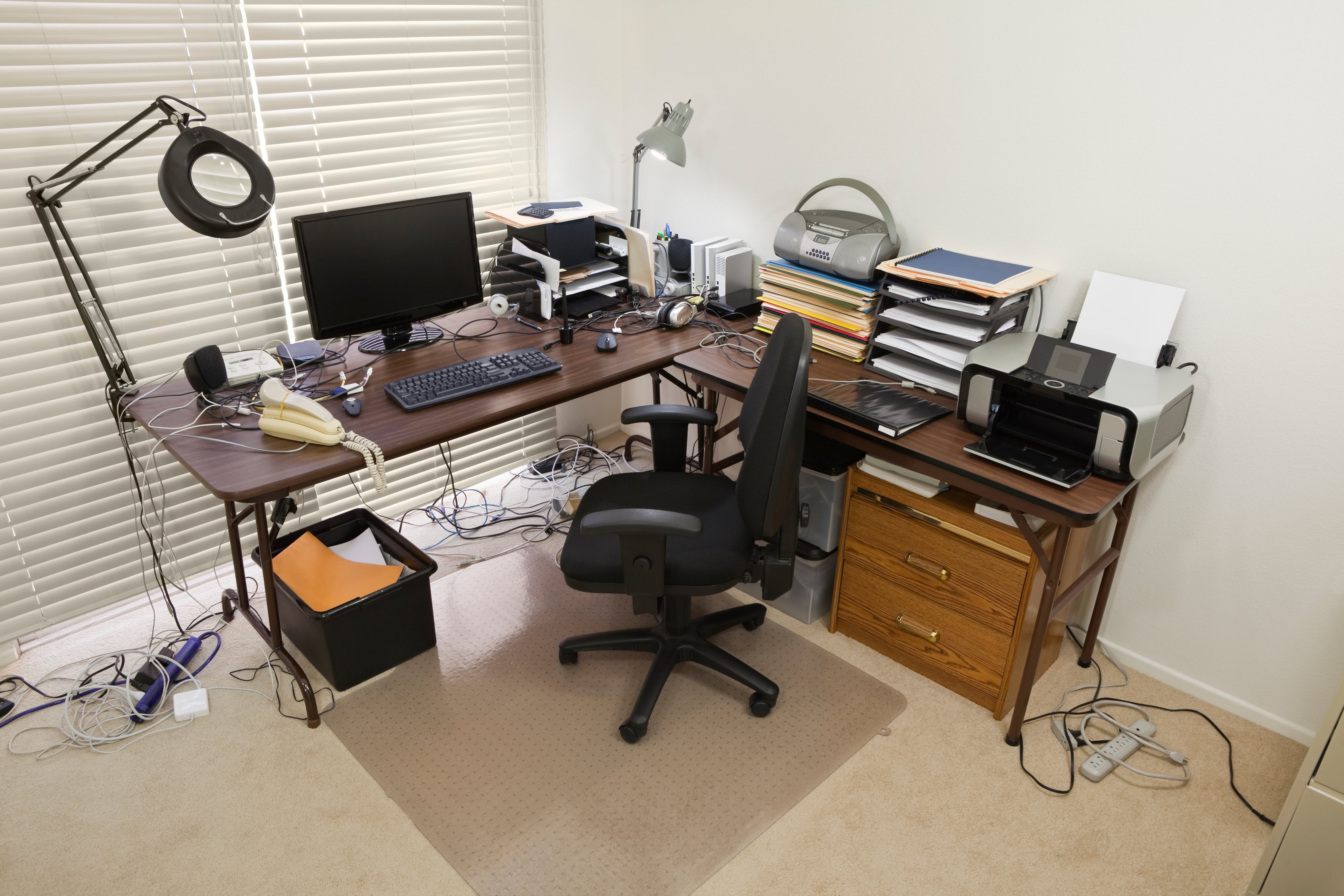 Two card tables in the corner of a room to create a work desk