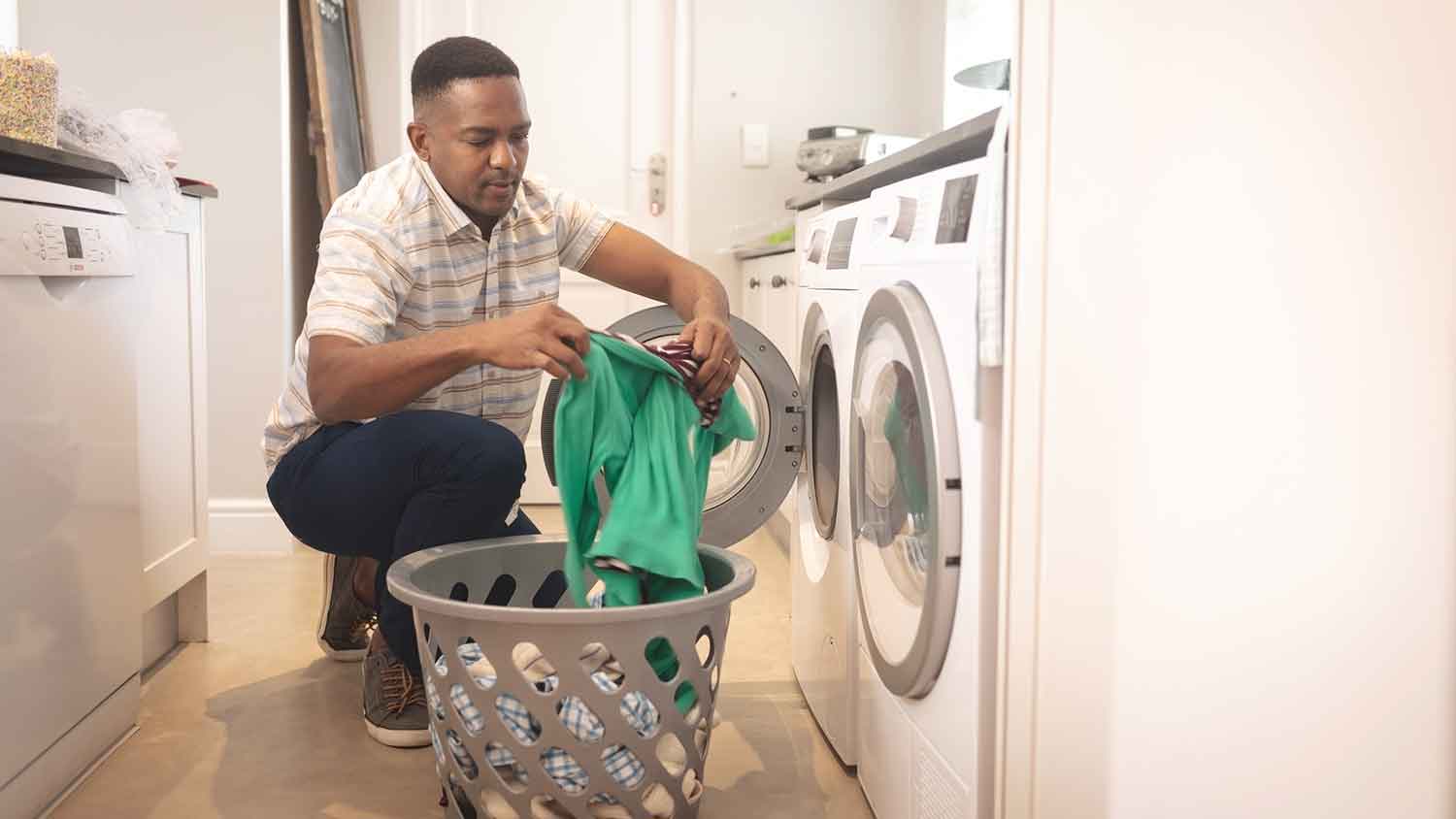 Man taking clothes out of the dryer