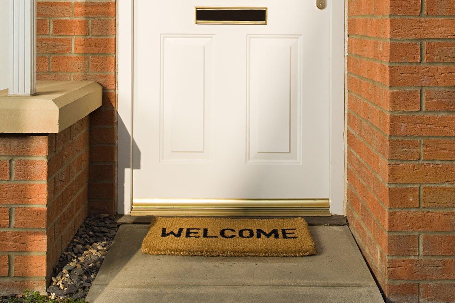 Outside door with metal kick plate at bottom