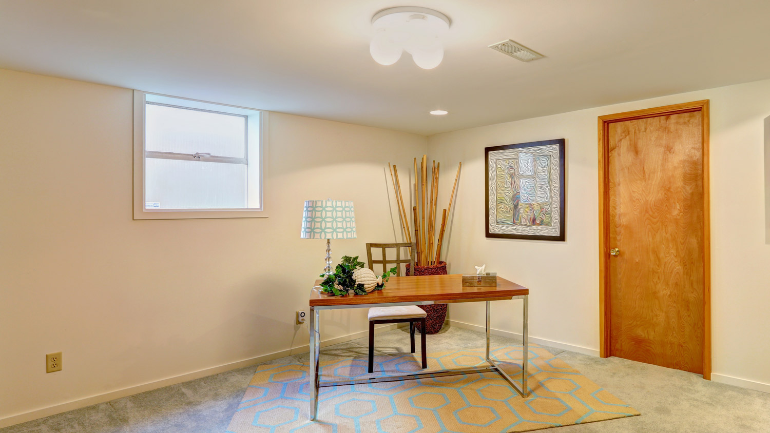 Basement office with a window  