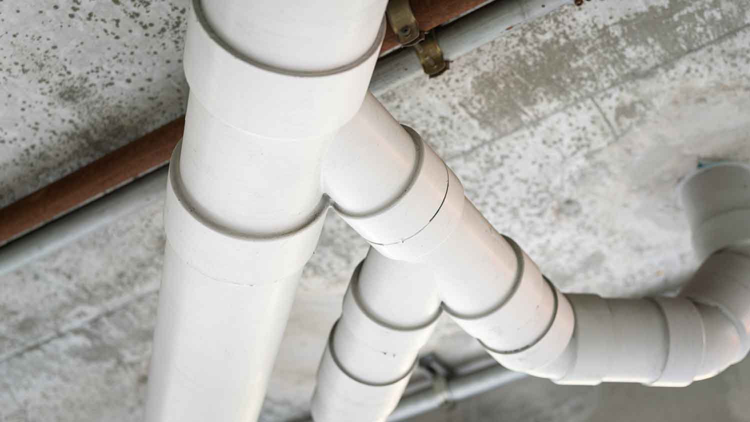 Closeup of pvc drainpipes installed in the house