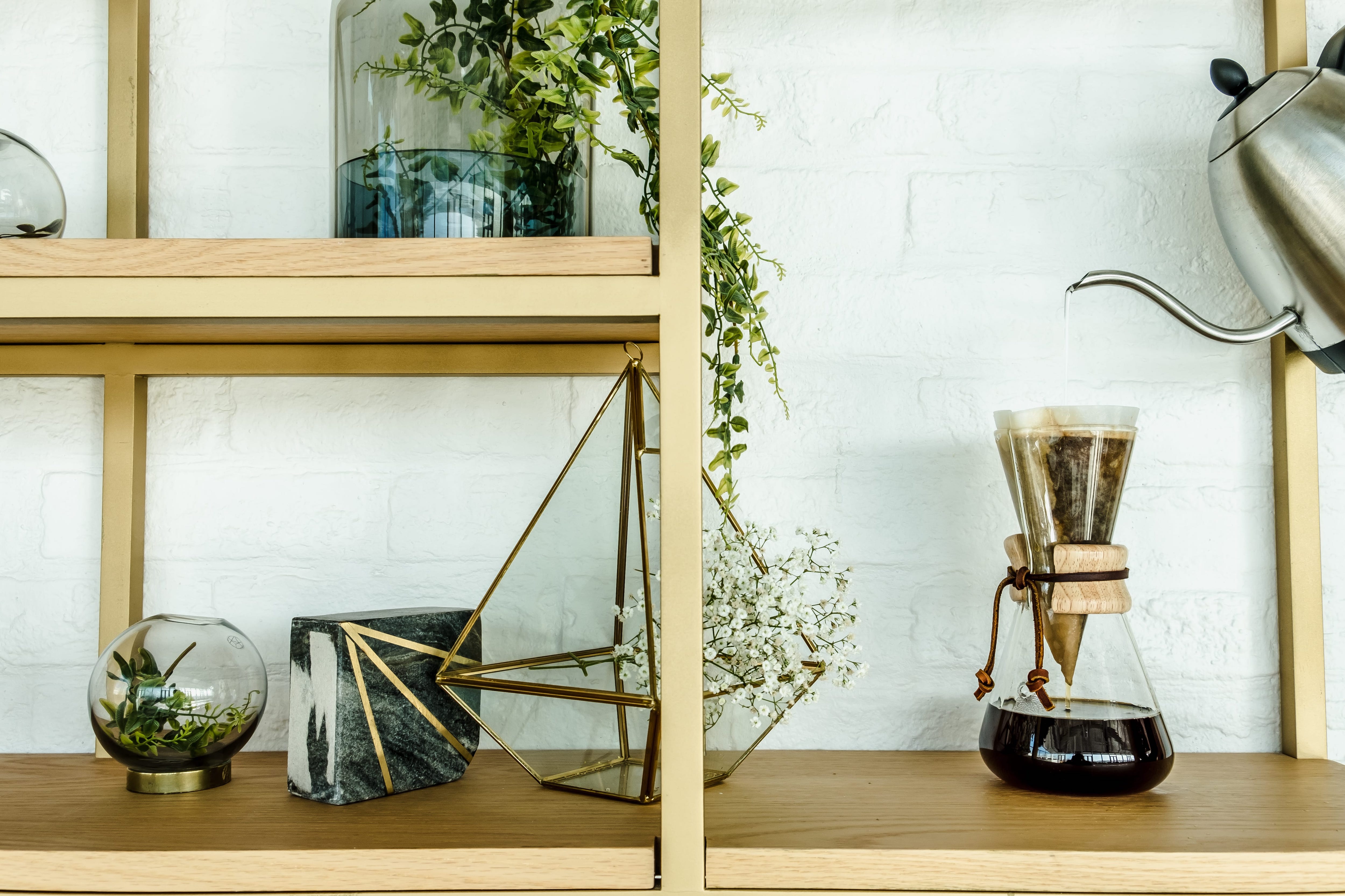 Couple making coffee in kitchen
