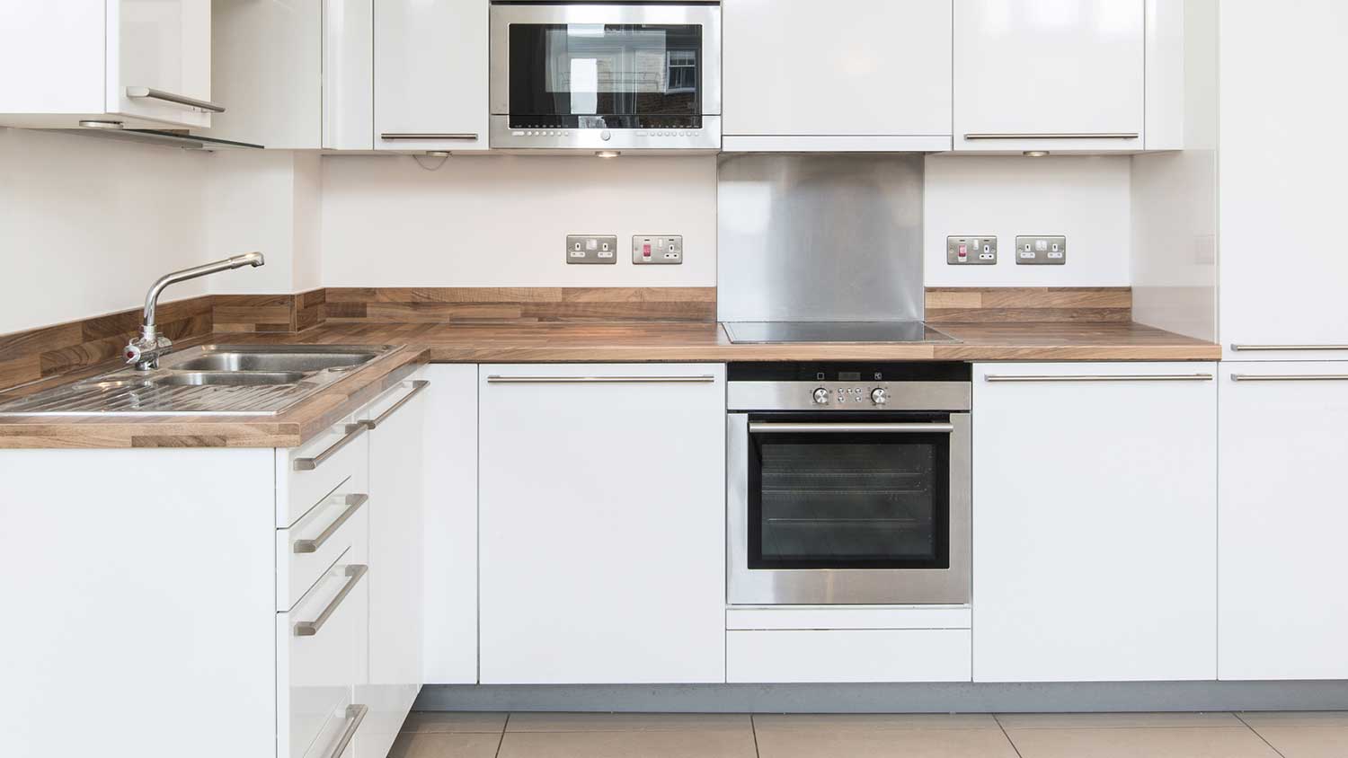 White kitchen with drop-in range