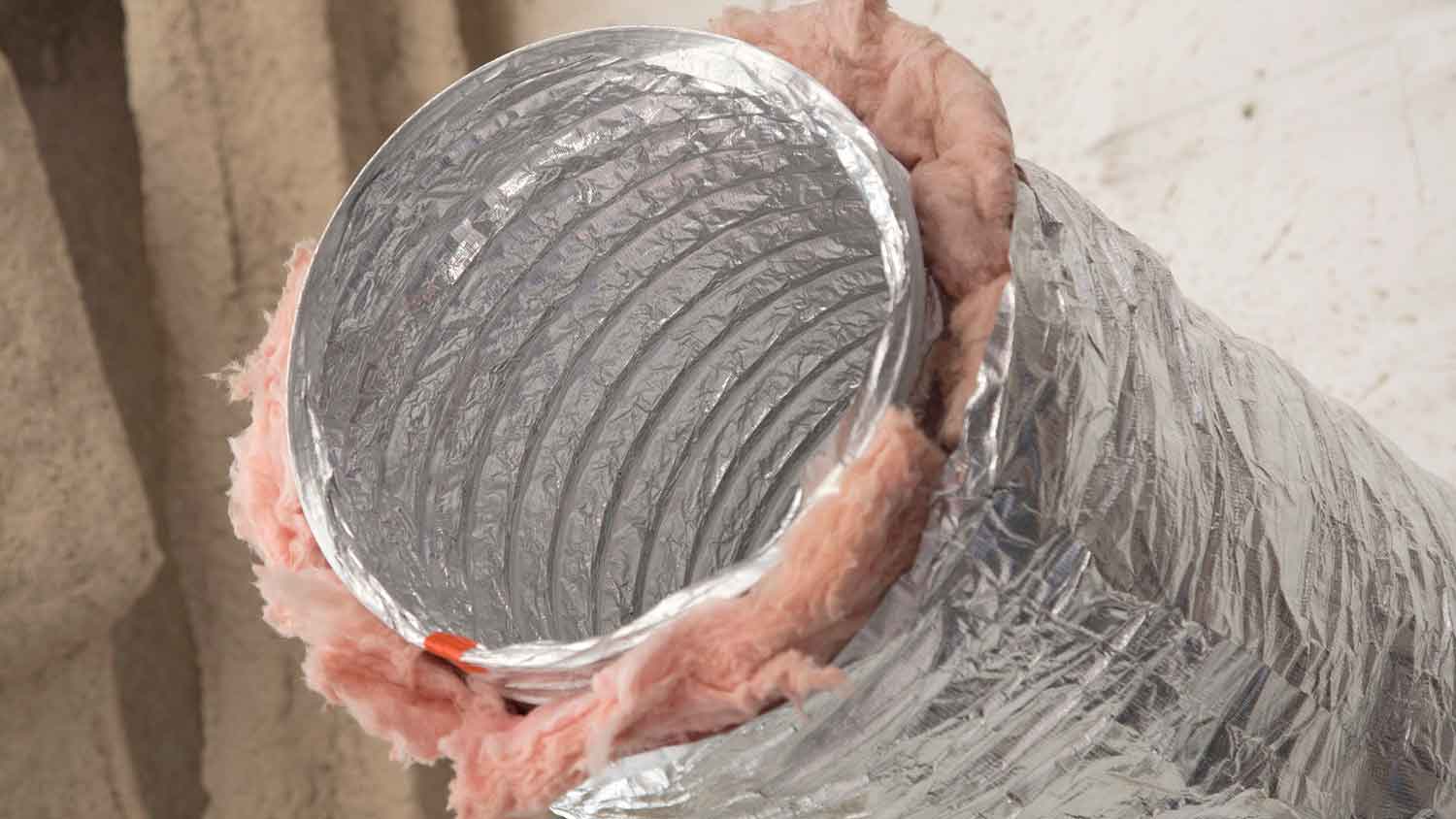 Dryer vent hose covered with insulation