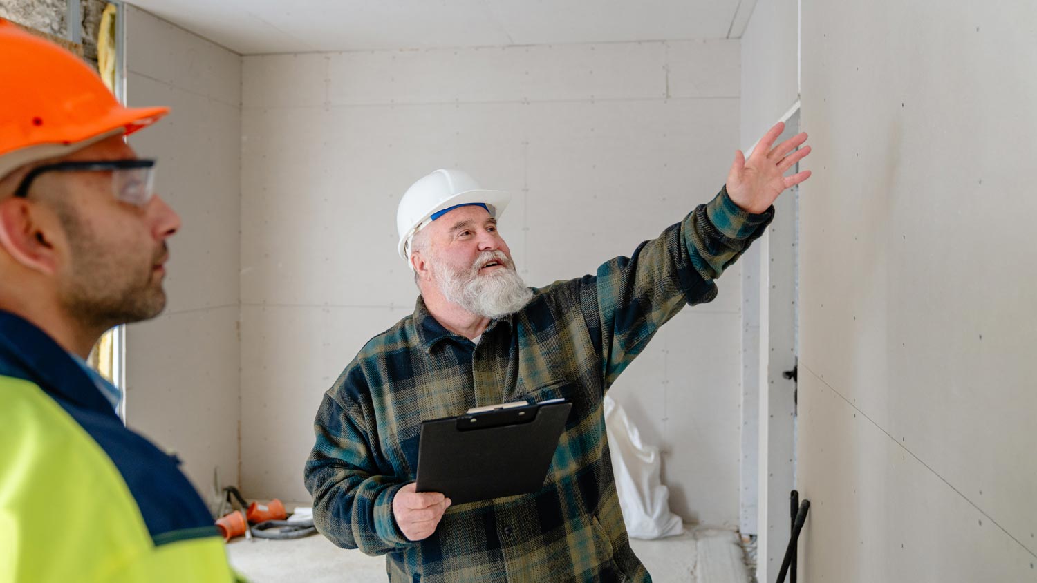 construction worker doing a drywall inspection