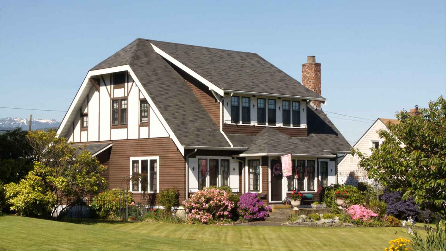 Suburban two-story home with Dutch gable roof