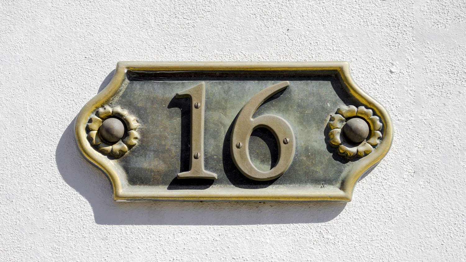 closeup of house door number 16