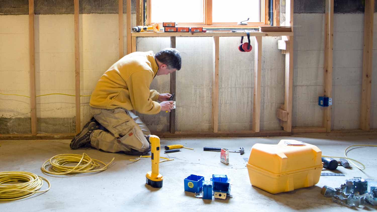 An electrician wiring a construction site