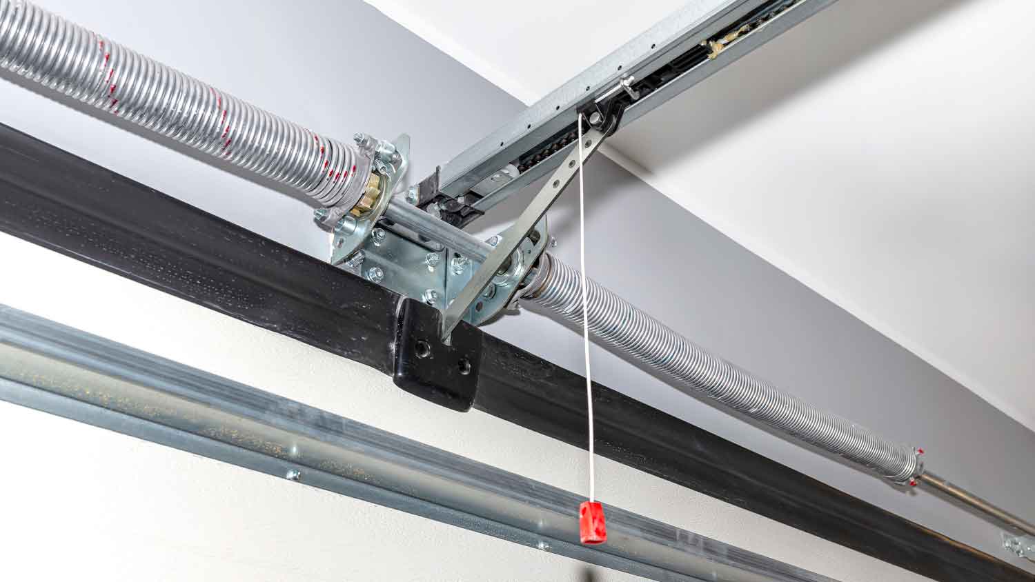 Garage door emergency release cord