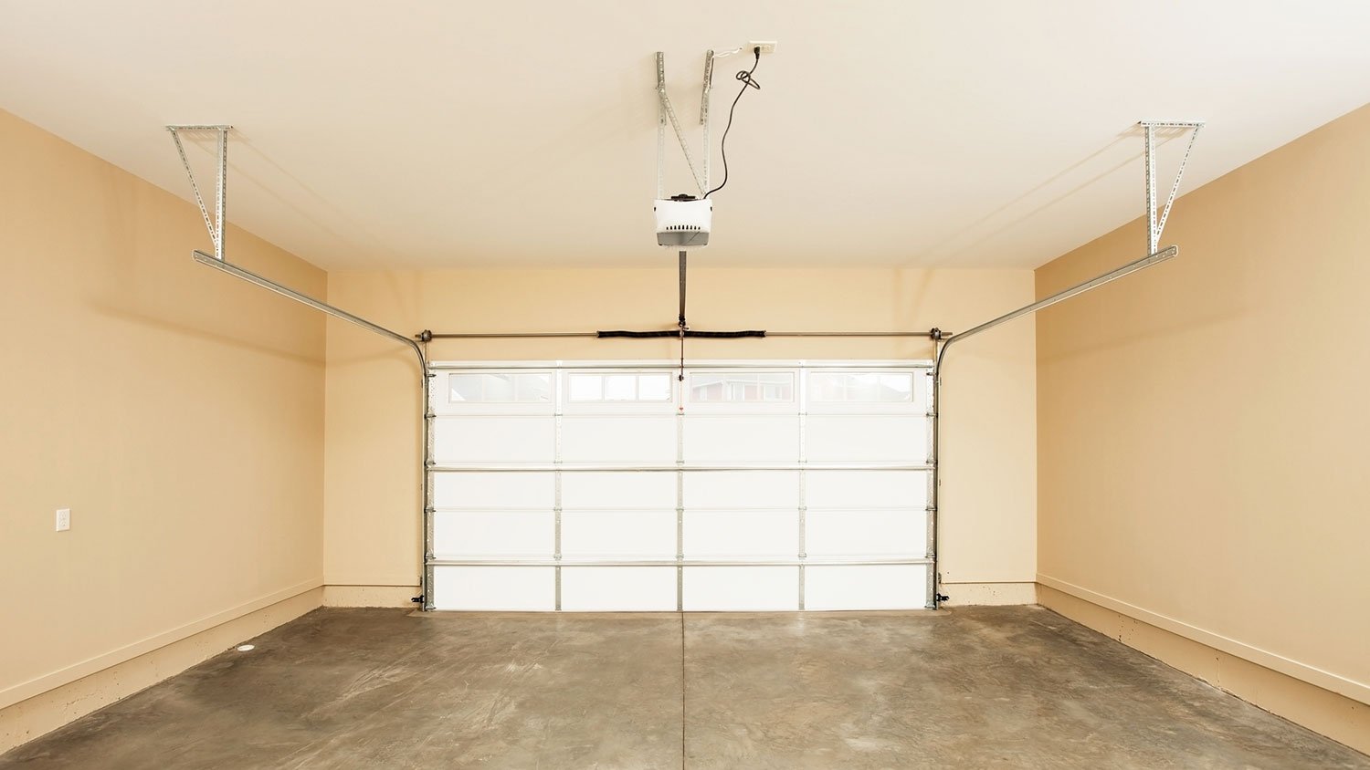 Two car garage interior with garage door closed