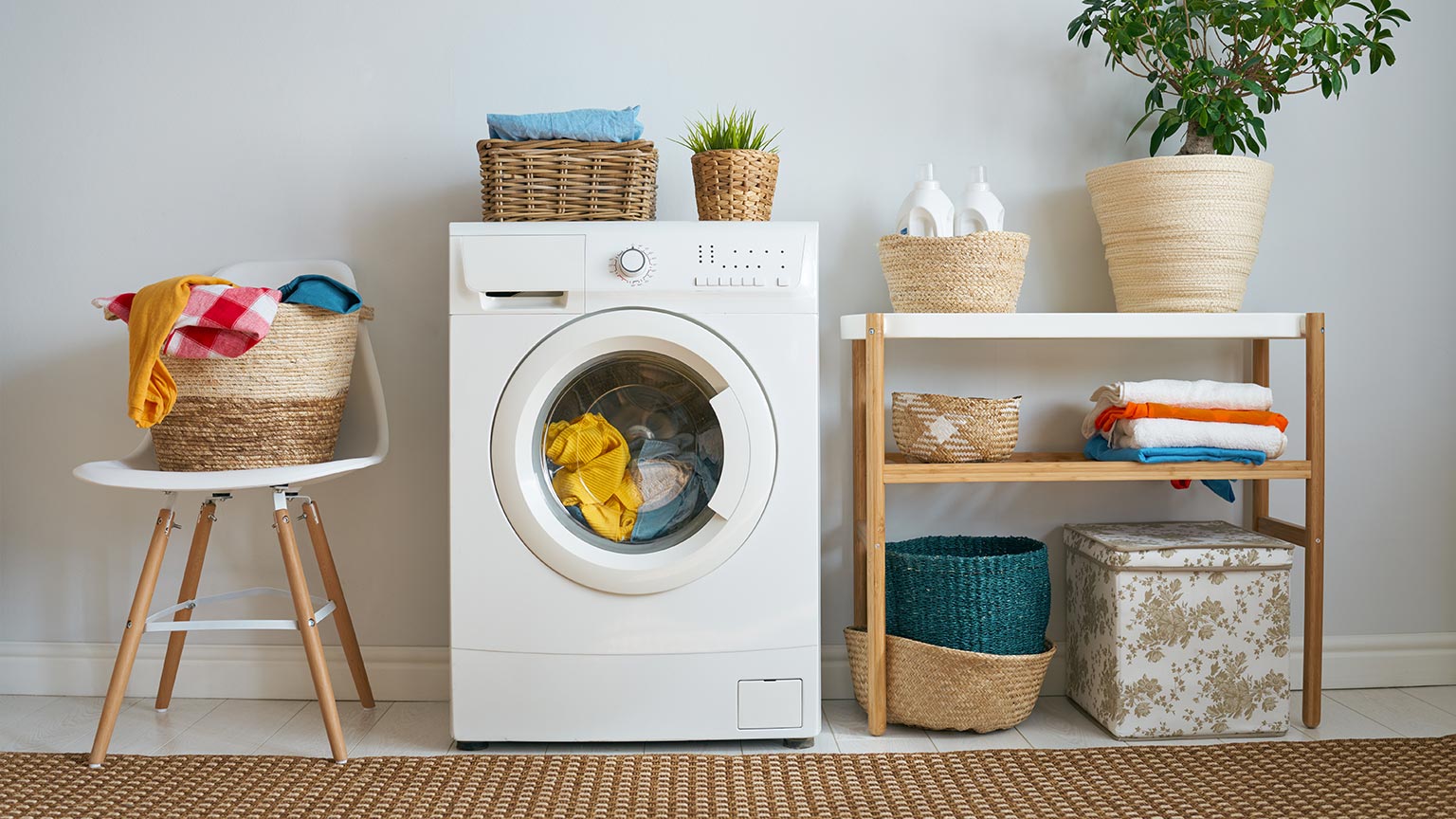 Interior of a brightly lit laundry room with a washing machine at home