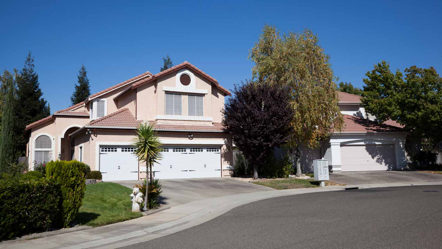 The exterior of a house with a concrete driveway