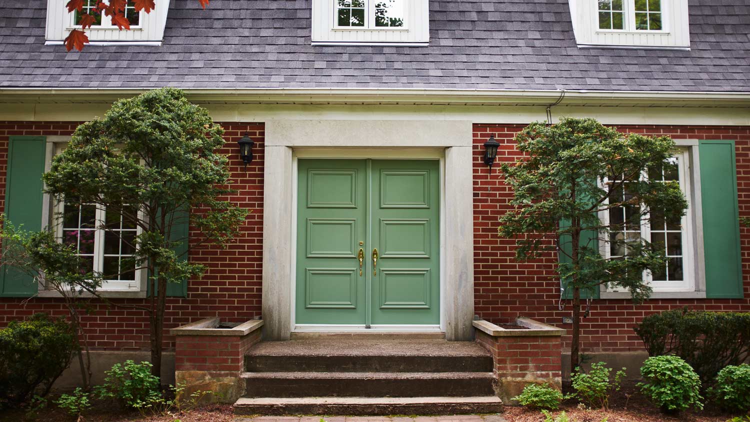 The exterior of a house with a double front door