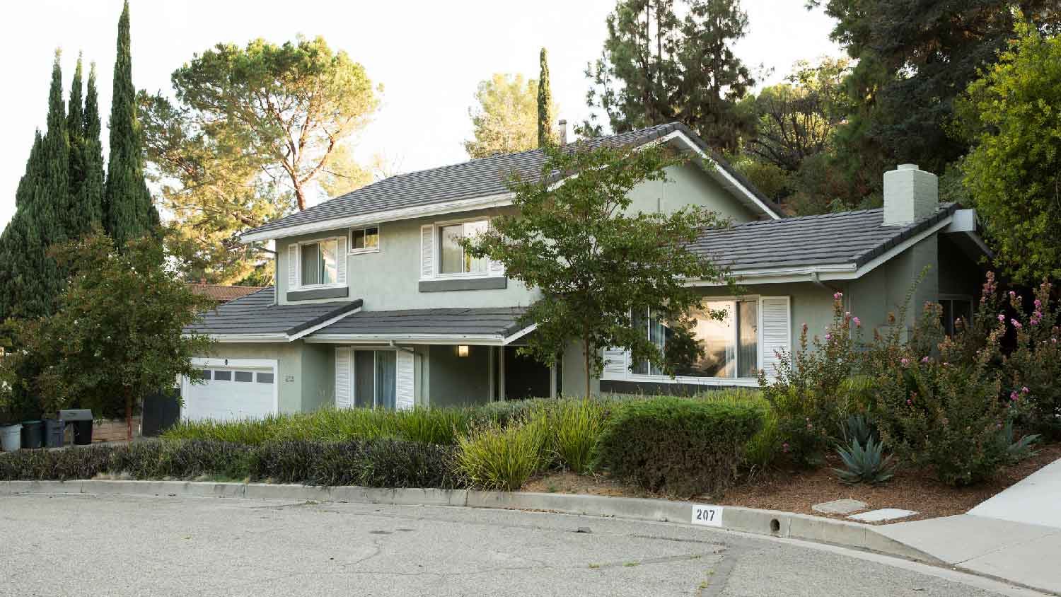 The exterior of a house surrounded by trees