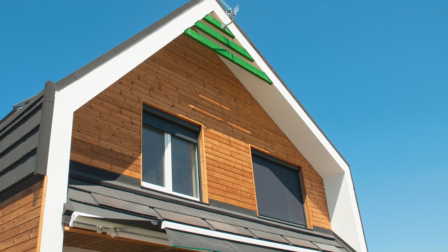A view of a house with exterior window shades