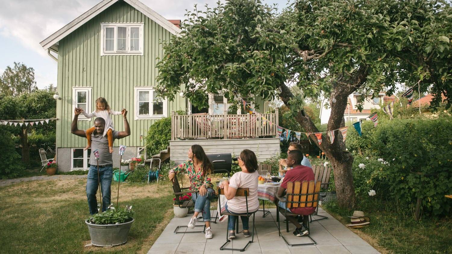 A family having dinner in the backyard patio