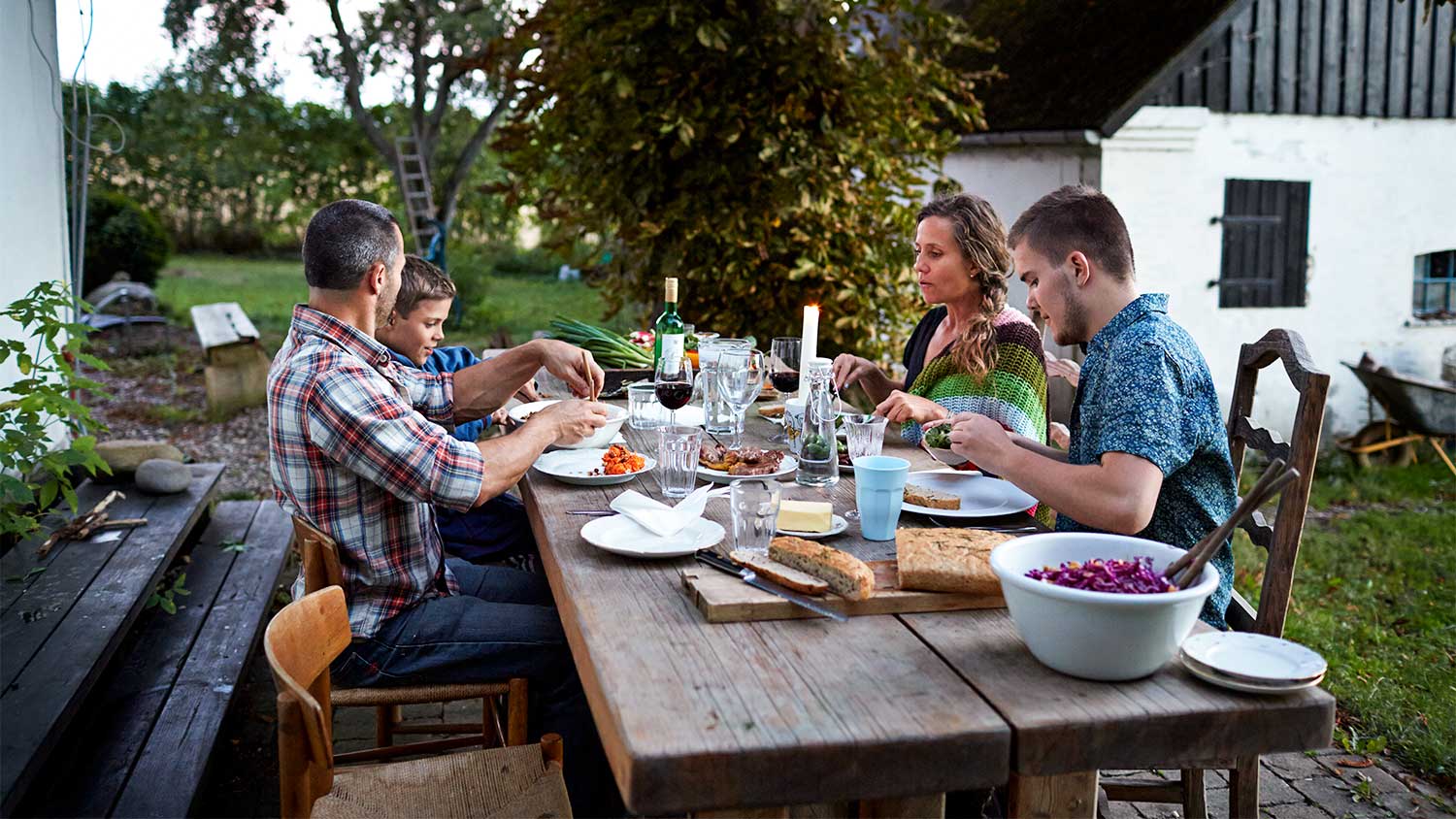 A family eats on a patio