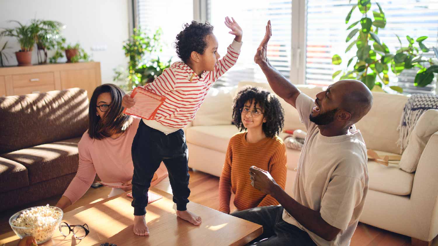 A family of four spending quality time in their bright living room