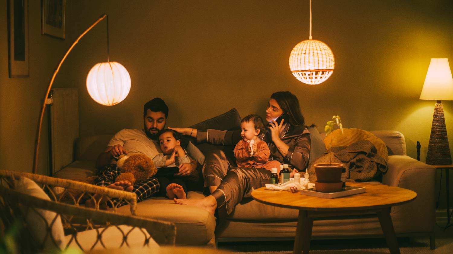 A family of four enjoying their night in the living room