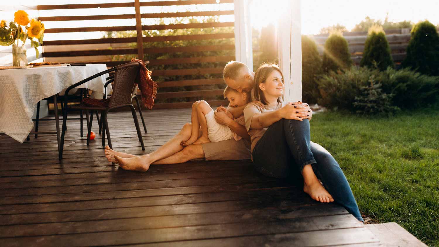 A family relaxing on a wooden deck 