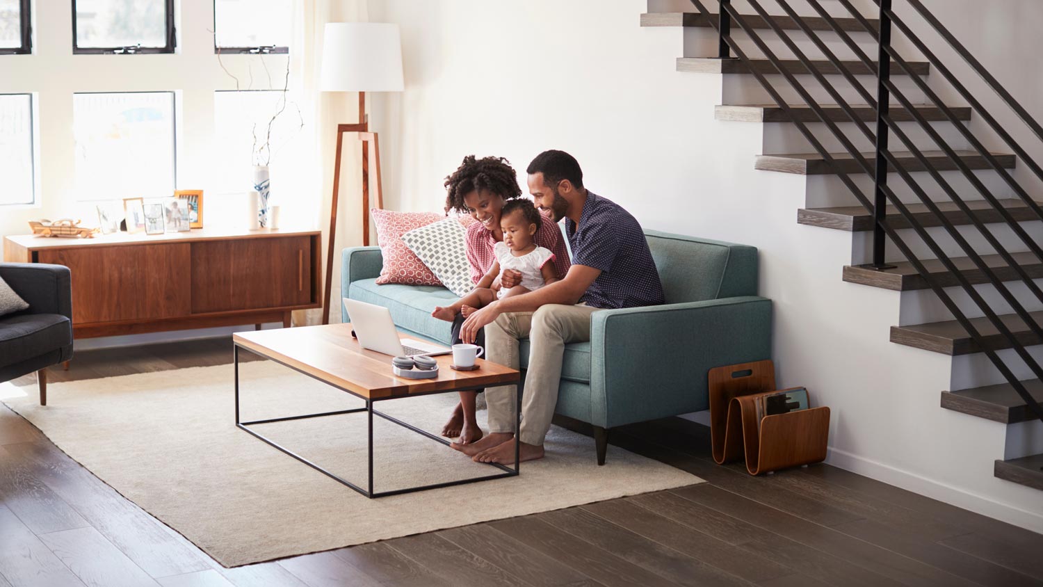 A family of three spending time together in their living room