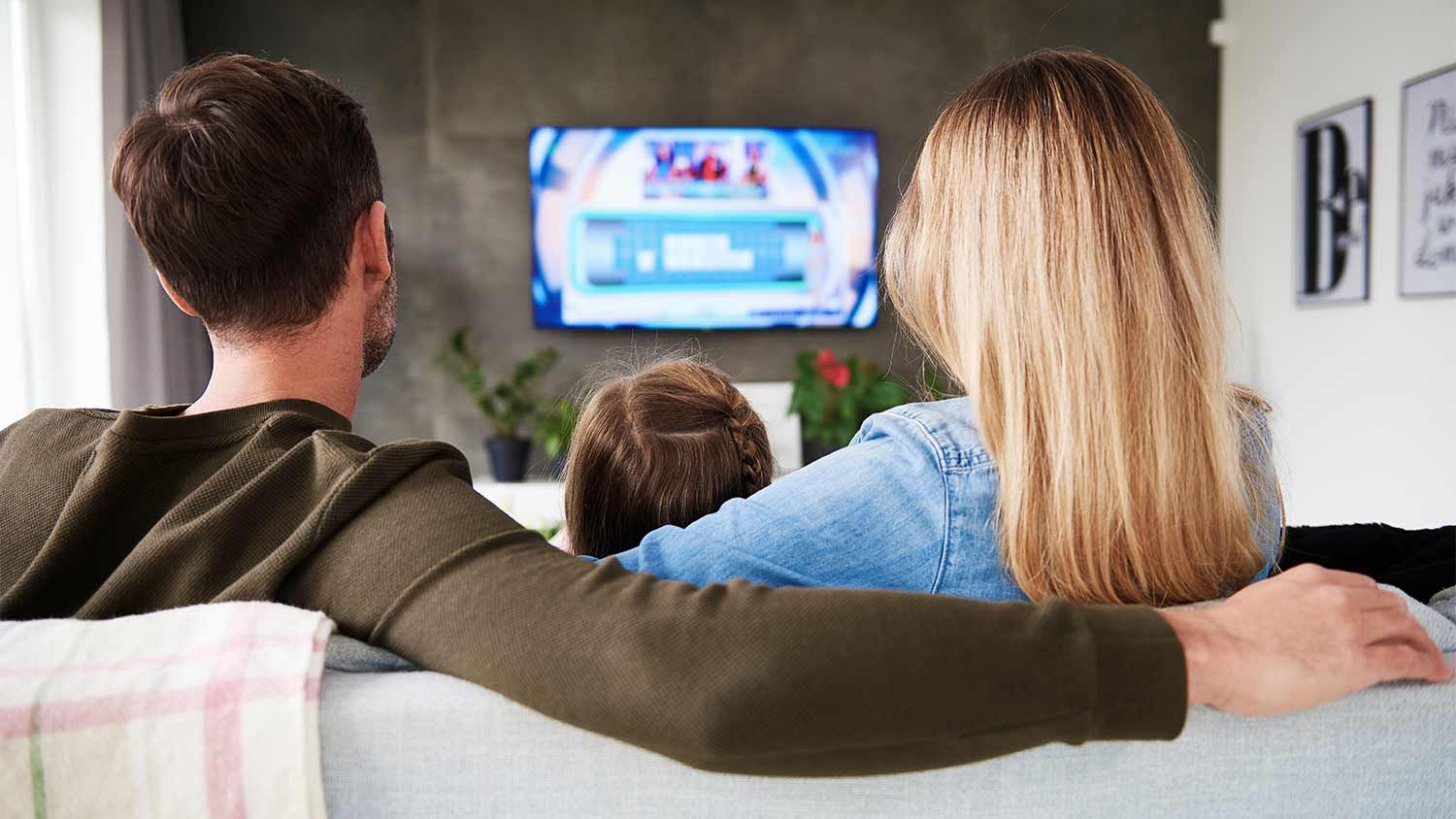 A family watches TV together