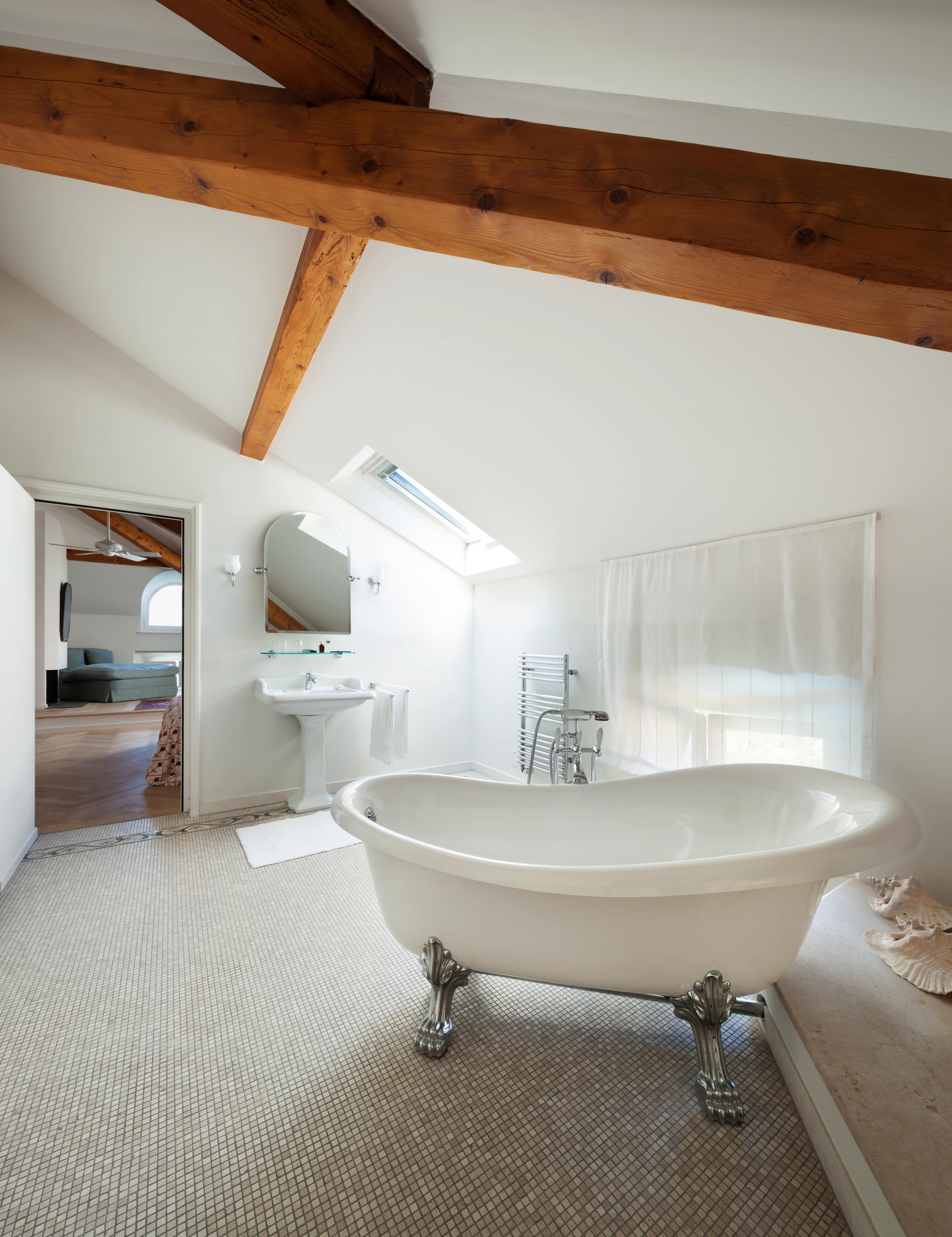 A simplistic bathroom with exposed wooden beams