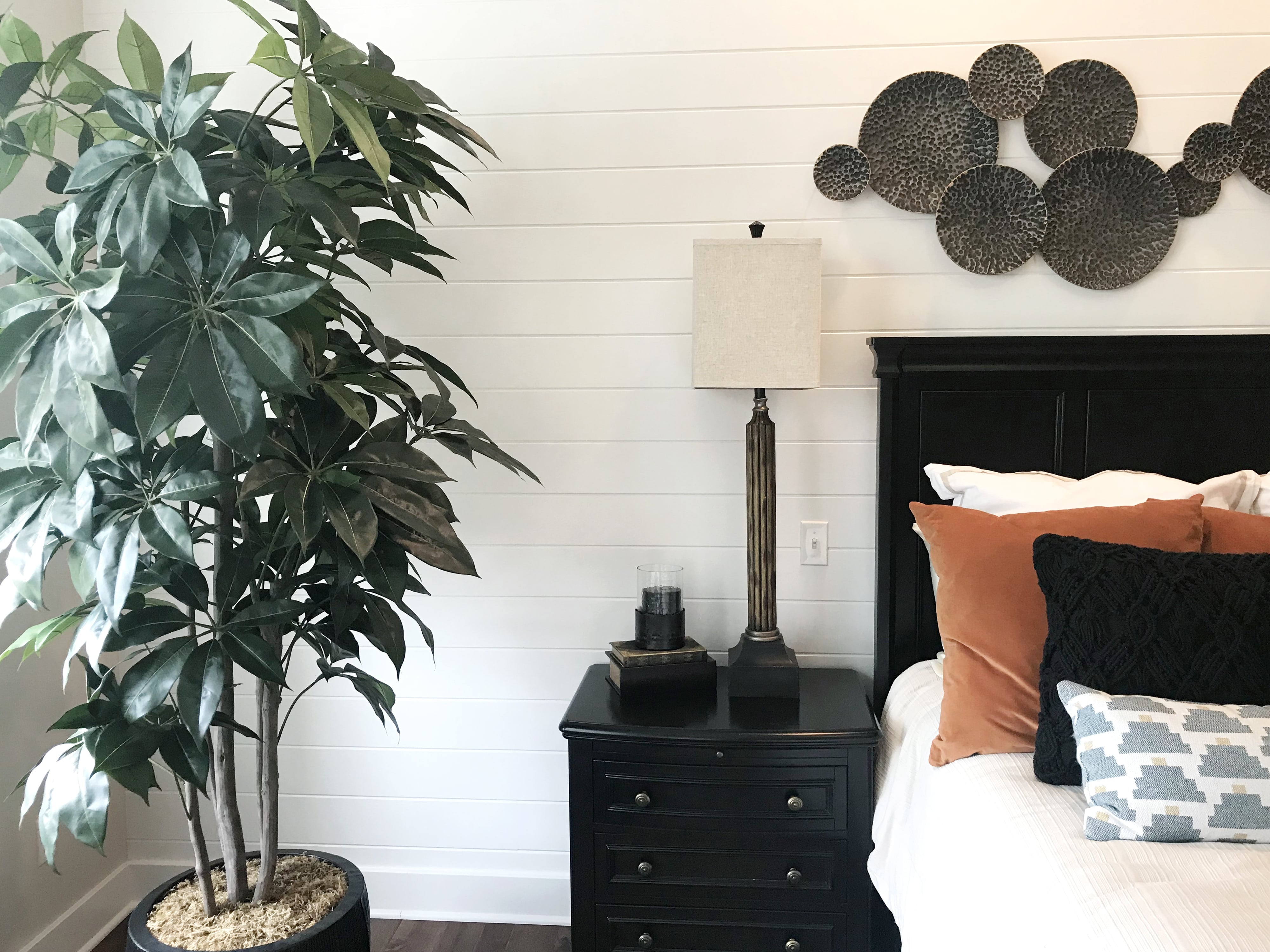 White shiplap walls in farmhouse bedroom