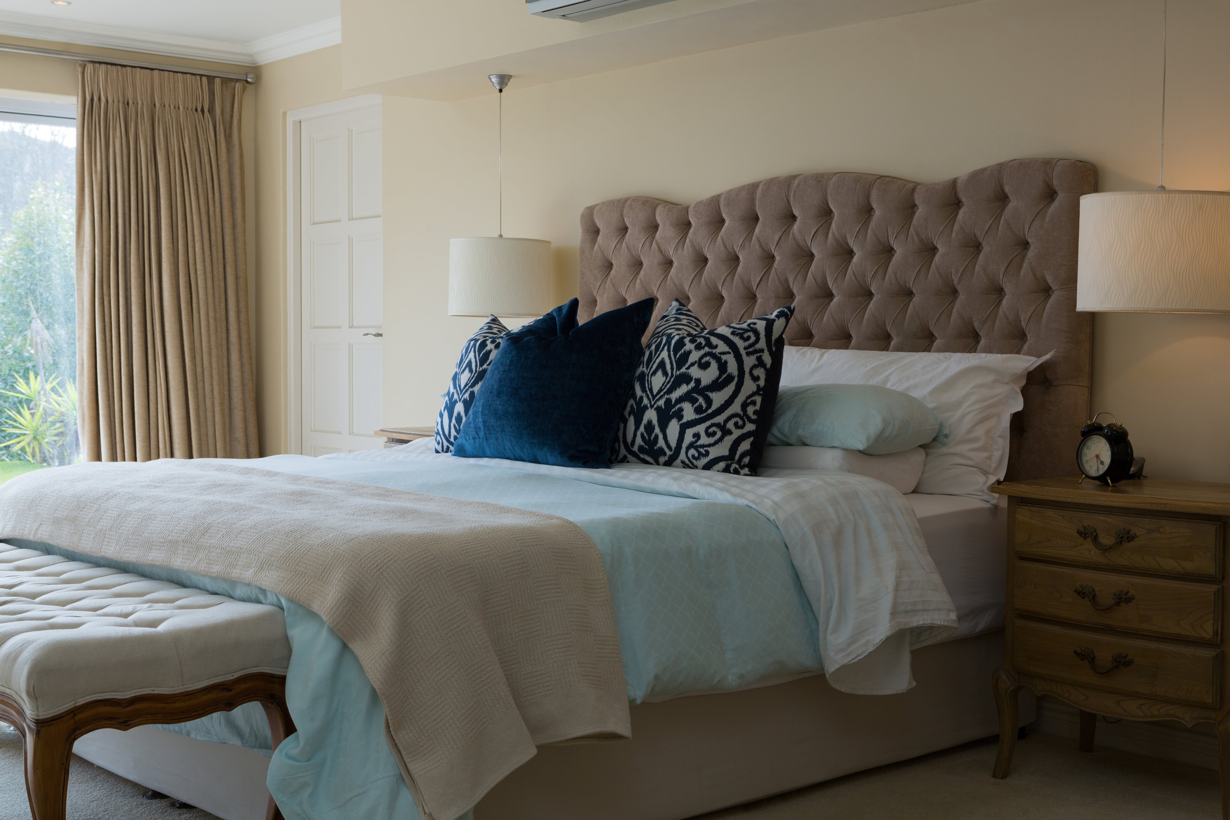 Tufted end-of-bed bench in bedroom