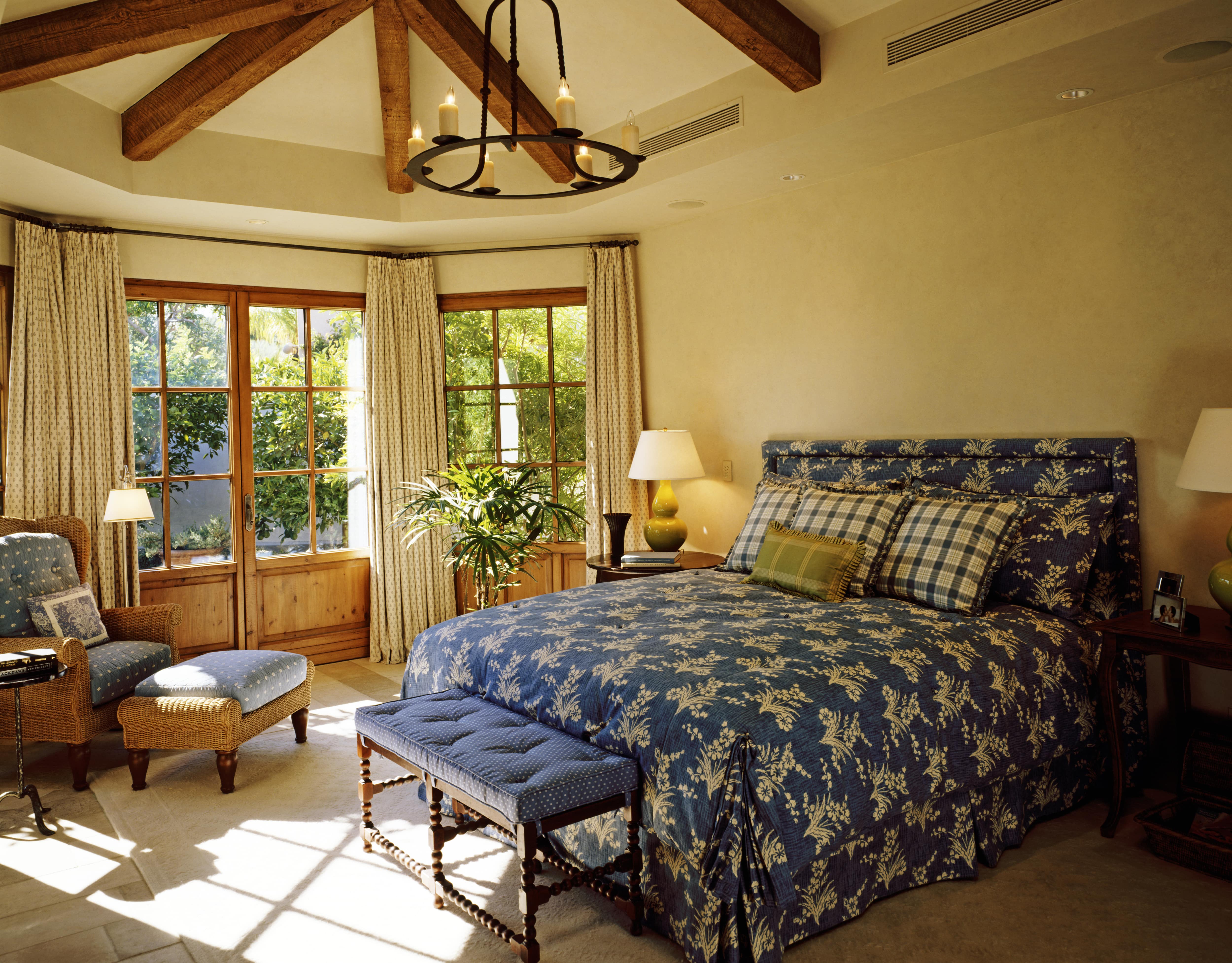 Exposed beams installed in farmhouse bedroom