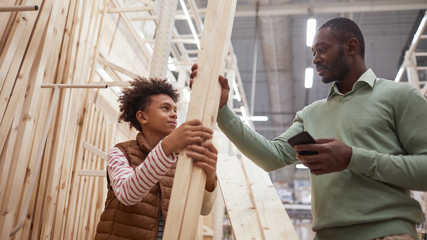 father and son shopping for wood
