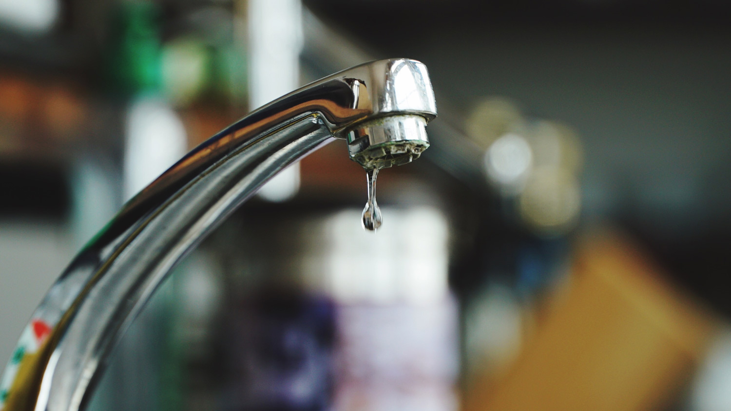 Close-up of a faucet dripping water