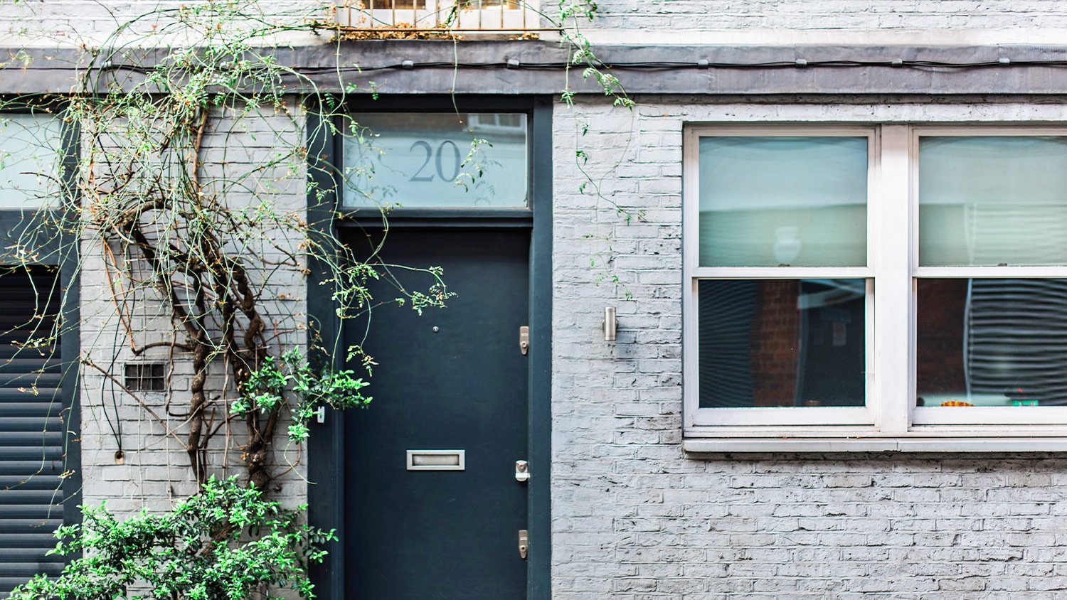 black door and gray brick, exterior of home