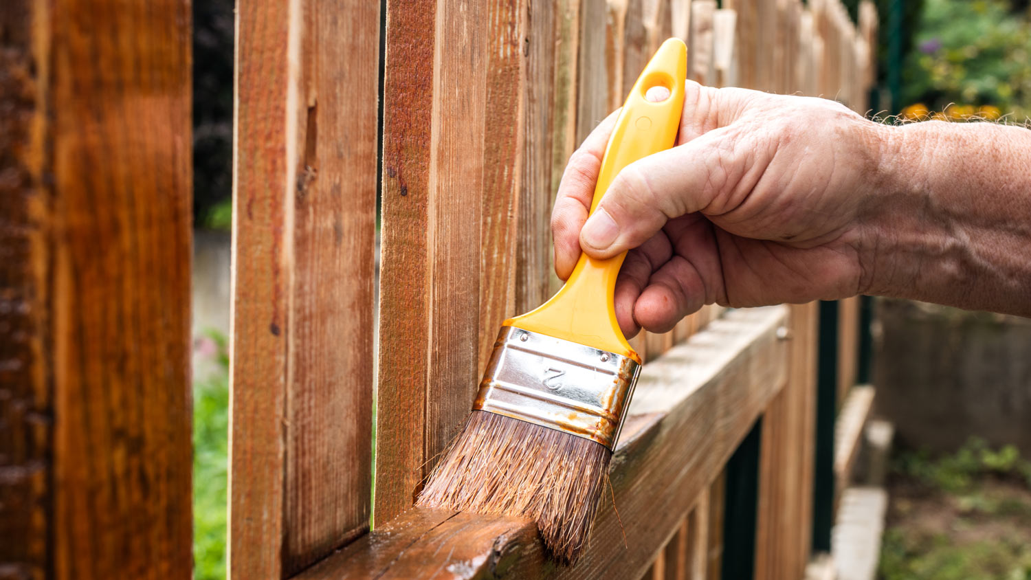 Painting picket fence by wood stain