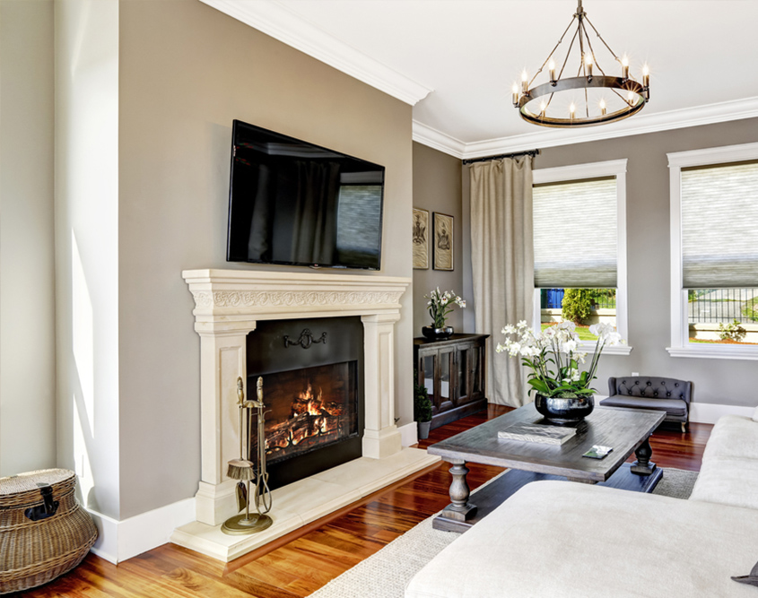 traditional fireplace mantel with TV mounted above
