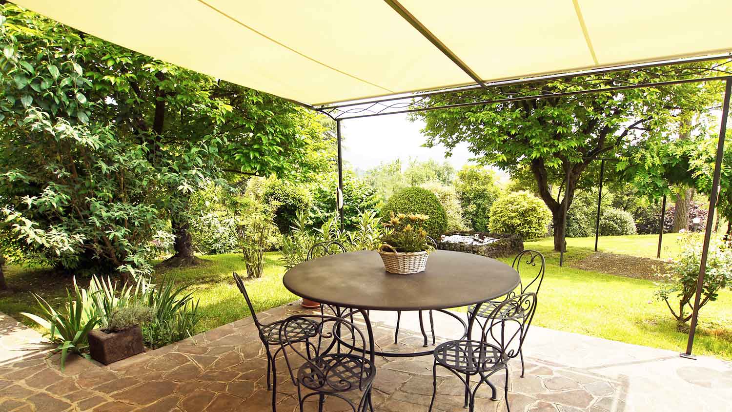 Patio awning providing shade to a patio table