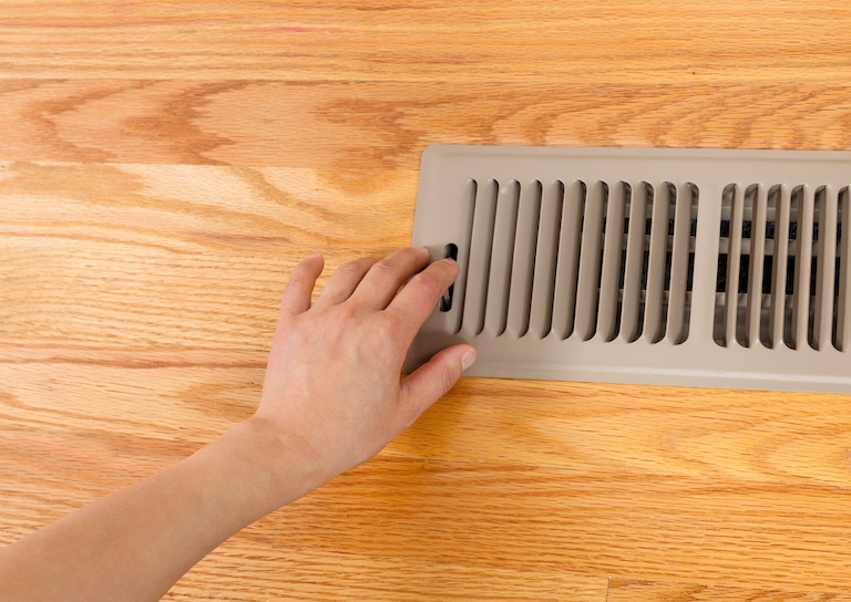 hand adjusting floor vent