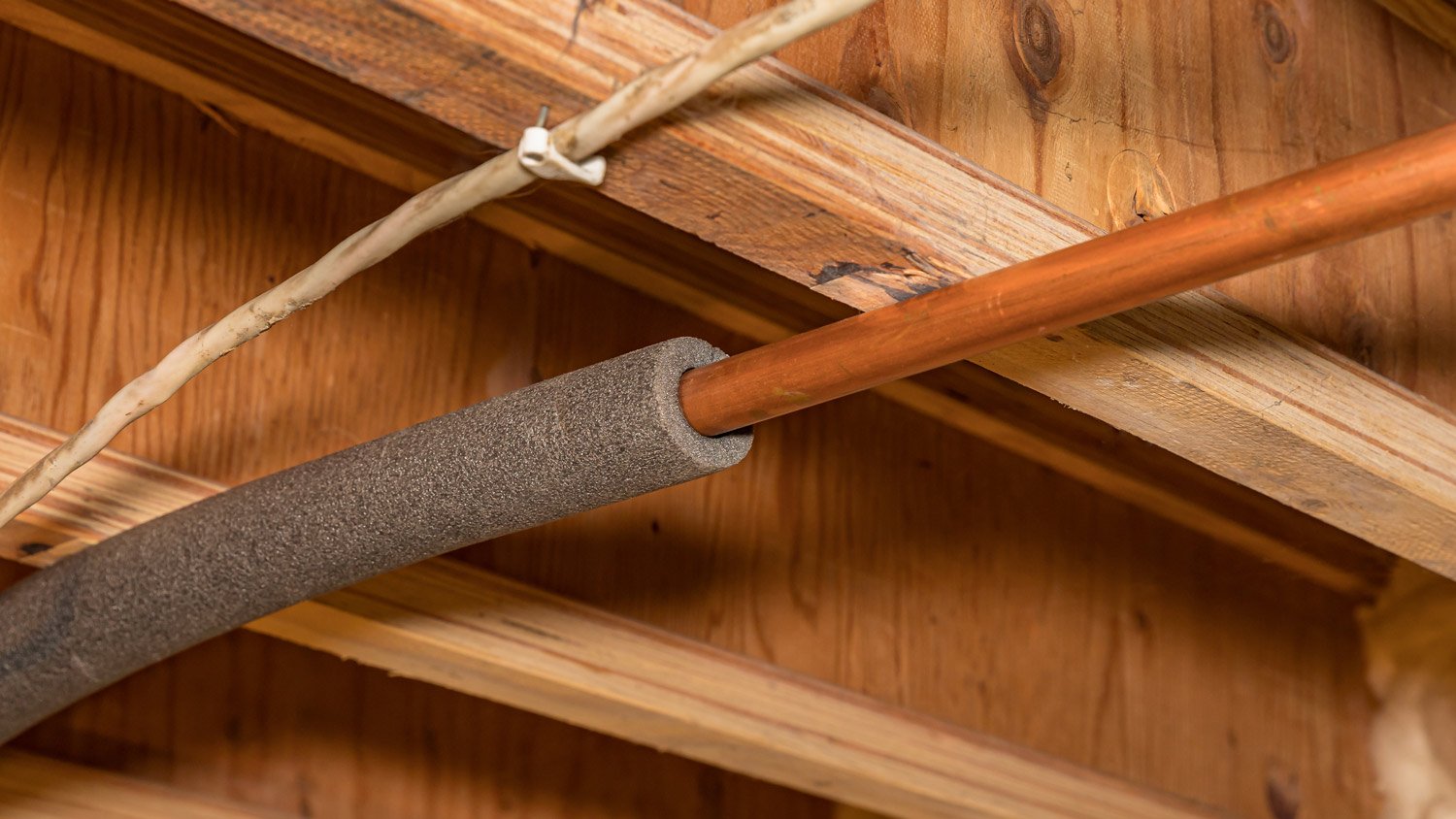 Water pipe with insulation in house crawlspace