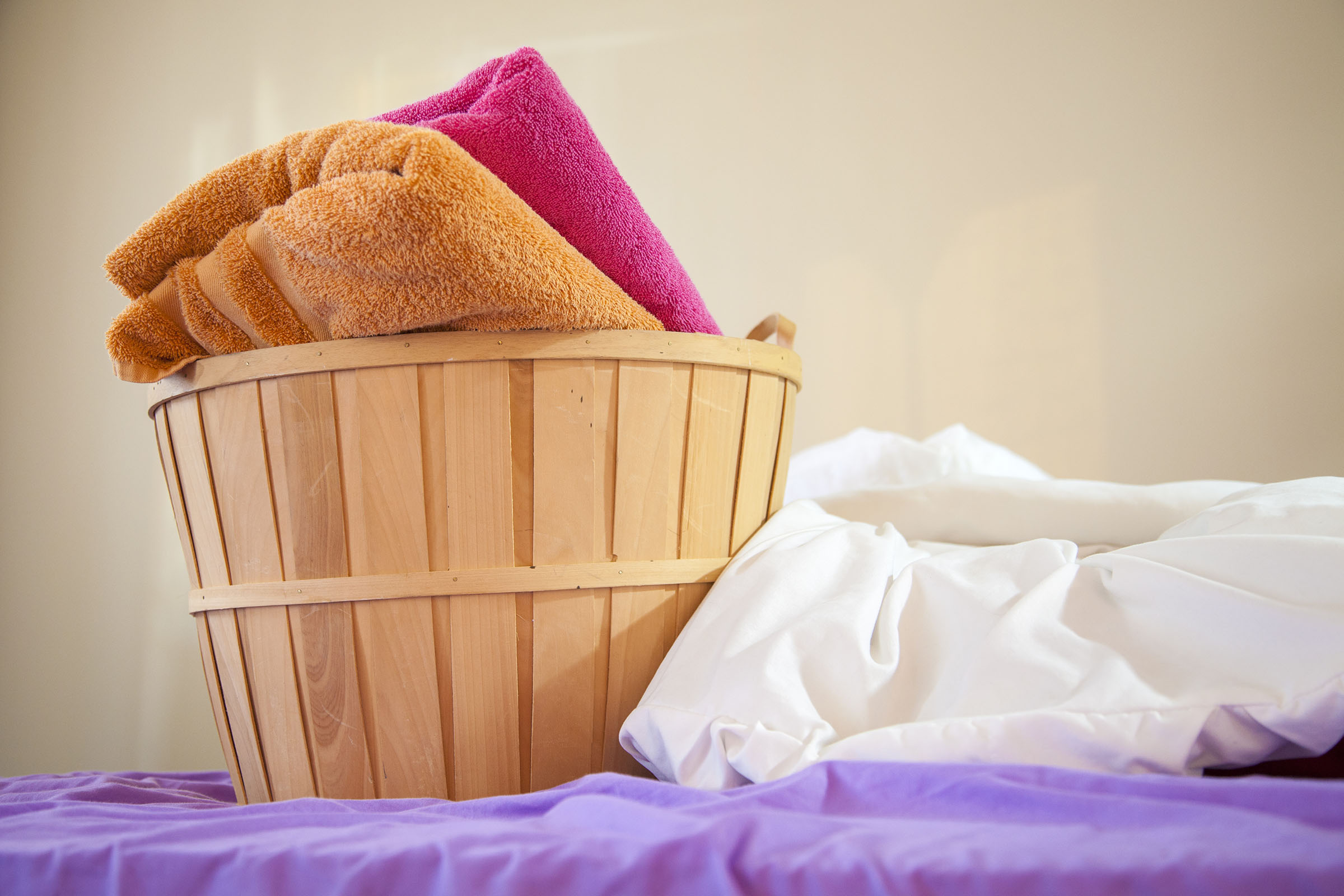 folded towels in laundry basket