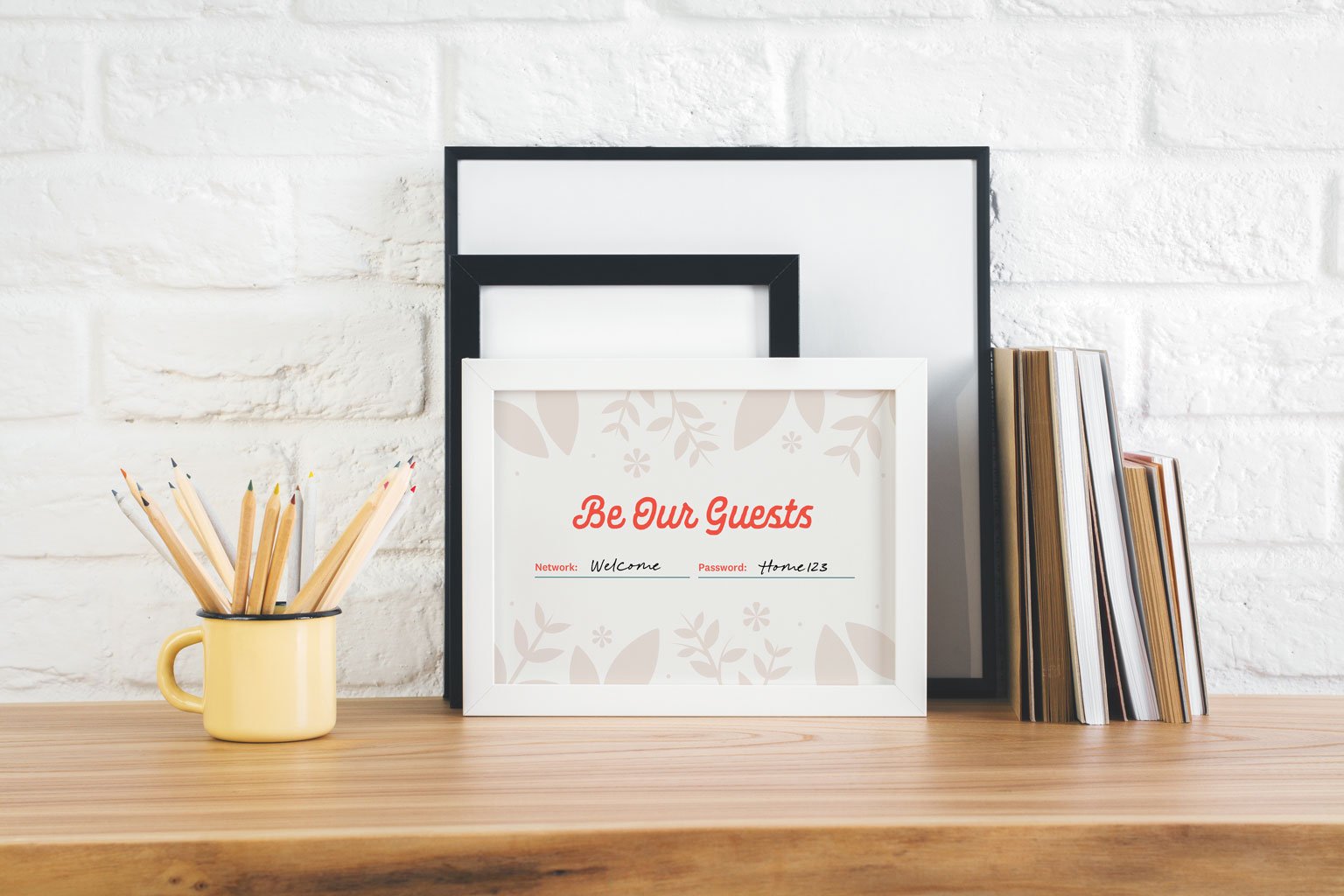framed picture reading "Be Our Guests"