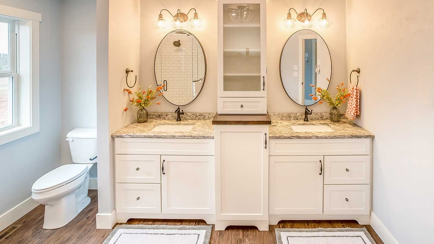 Double freestanding vanities installed in the bathroom